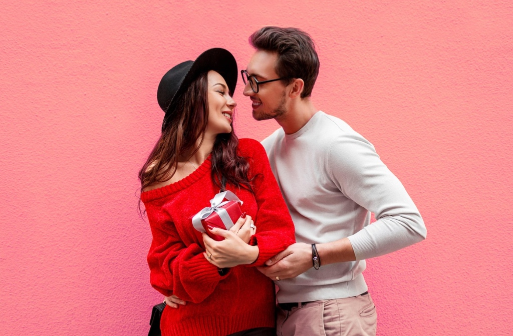 Western suitor presenting romantic gift to smiling Slavic bride - courtship etiquette