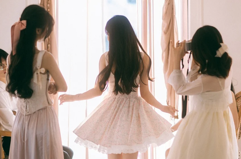 Southeast Asian women in elegant pastel dresses reflecting sisterhood, community and family unity